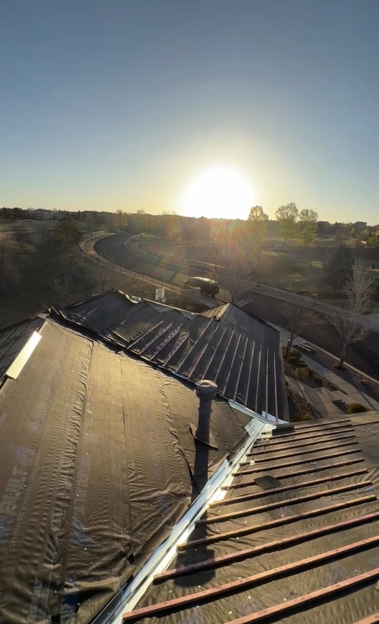 Sunrise over a Colorado roof during a metal underlayment install