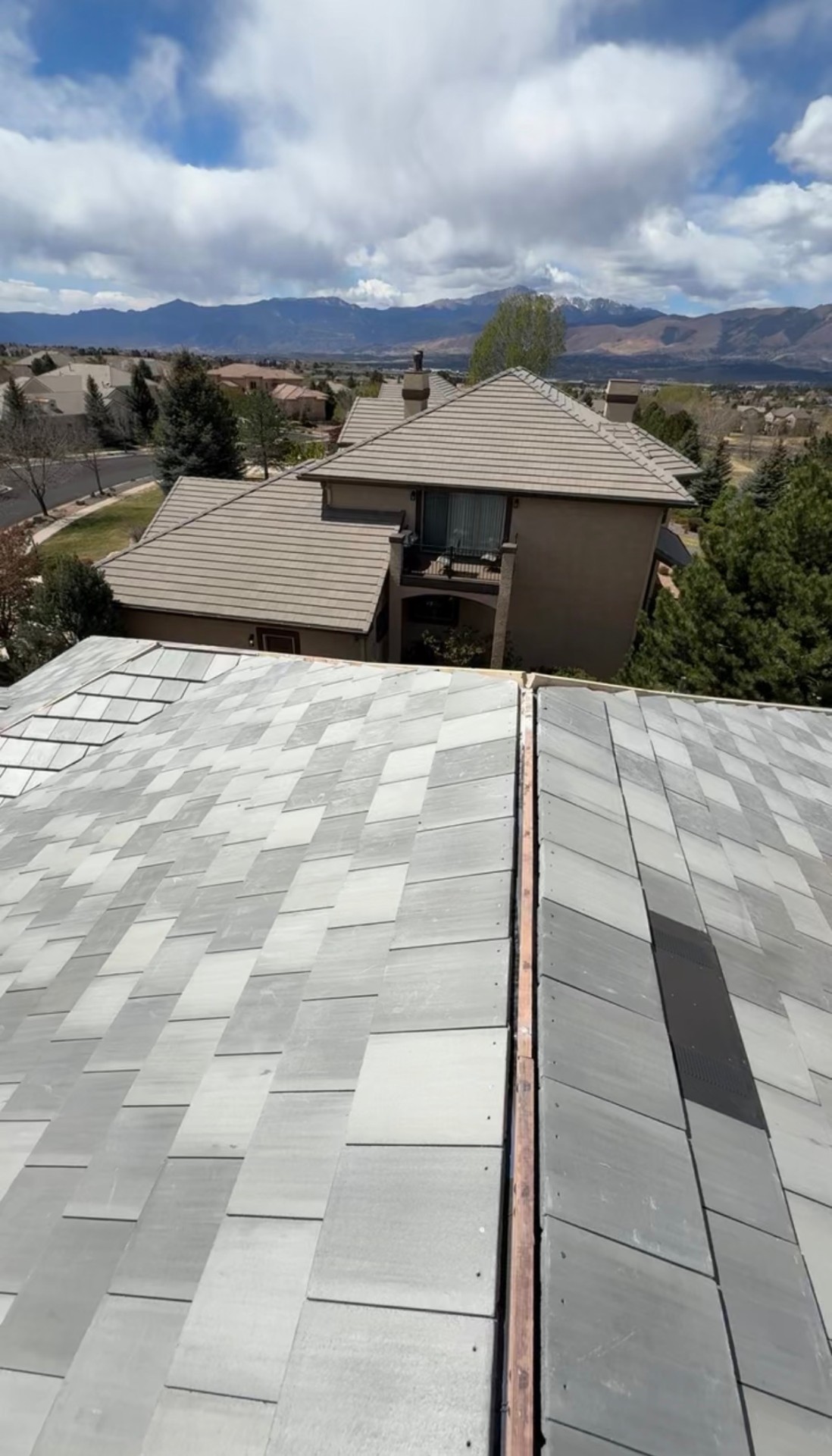 Stone-coated steel roof with view of Pikes Peak